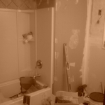 toilet relocate, sink relocate, new tub and surr.