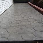 Stamped Concrete Patio with retaining wall.