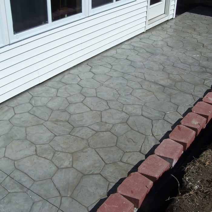 Stamped Concrete Patio with retaining wall.