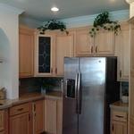 tuscan kitchen with light wood cabinetry