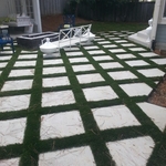 Patio with turf and paver stones