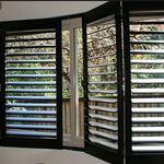 dark stained plantation shutters