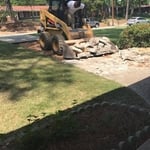 Moving out the busted out Concrete