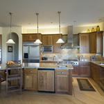 spacious kitchen with walnut cabinets