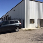 Aluminum Commercial Building with Black Metal Security Fence