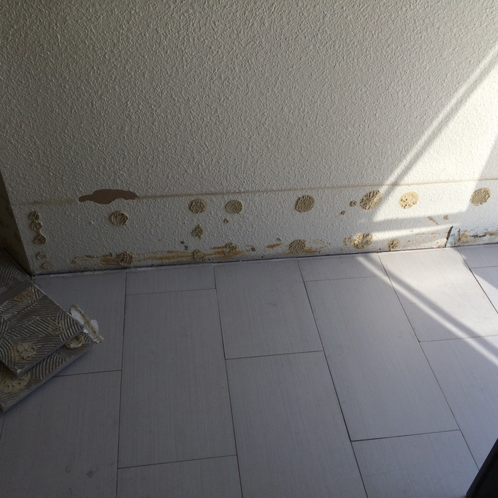 grey porcelain tile floor in hallway