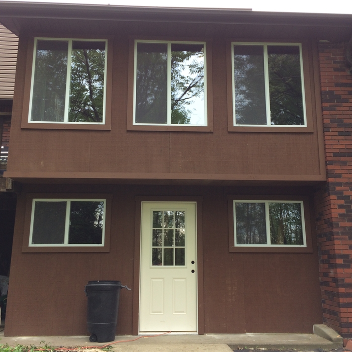 Large windows with custom stained trim