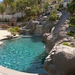 outdoor rock pool with slide