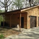 Exterior garage with two single car garages and cedar wood siding