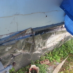 Busted Stone Detached from rotted wood