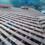 Roof Tear-off with plywood loaded at ridge.