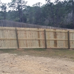 6' wood fence downhill