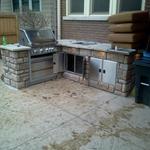 Grill with ice chest and two cabinets