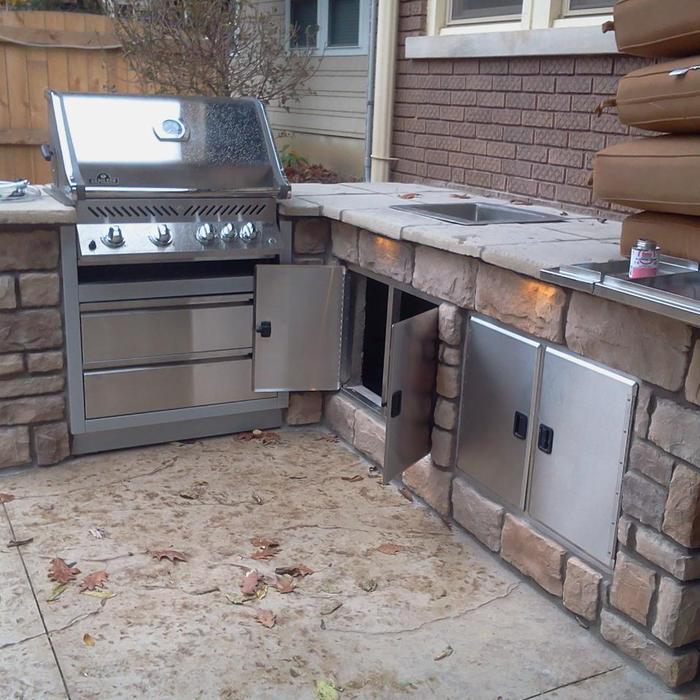 Grill with ice chest and two cabinets