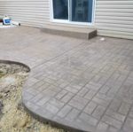 Concrete Patio with Brick Detailing!