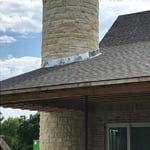 Round rock outdoor fireplace and chimney