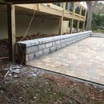 Granite retaining wall with paver floor