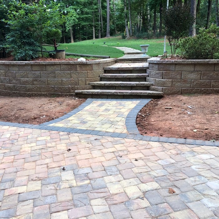 SRW retaining wall with steps and paver driveway