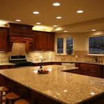 Large traditional kitchen with granite countertop, stainless steel appliances, and dark wood cabinetry