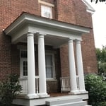 Single story side porch constructed from foundatio