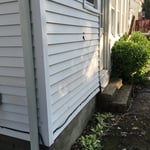 old siding, previously damaged