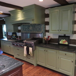 Green cabinets in old world architecture