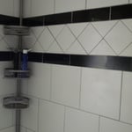 Bathroom with walk-in tile shower and sliding glass door