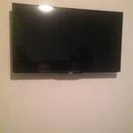 TV Mounted On Wall With Wires Concealed