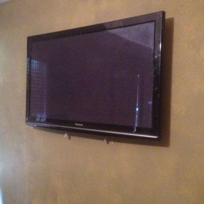TV Mounted On Wall With Wires Concealed