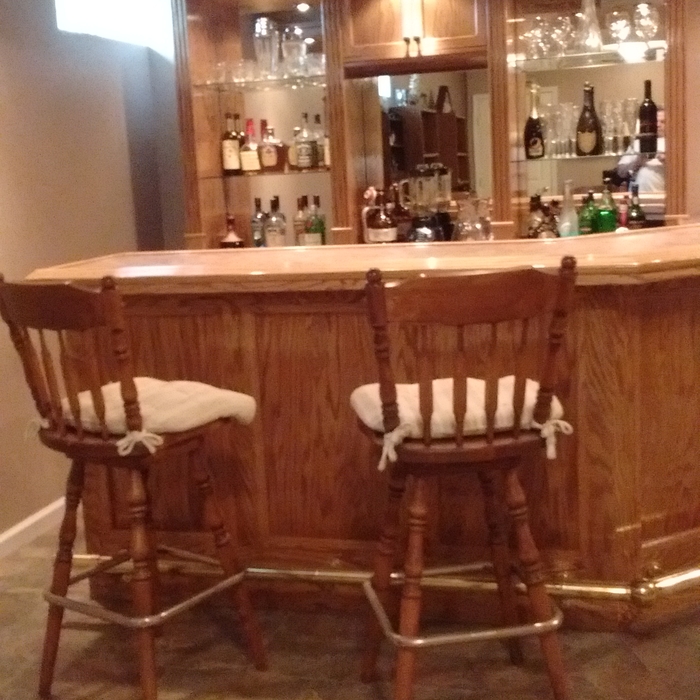 basement wet bar with barstool seating