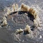 Sewer manhole erupting in shopping center