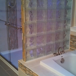 Glass shower divider wall with LED lighting