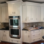 After - Cabinet refinishing completed.