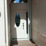 arched window over front entry