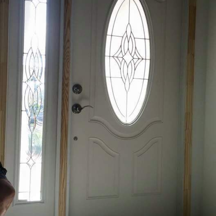 windowed entry door with decorative glass