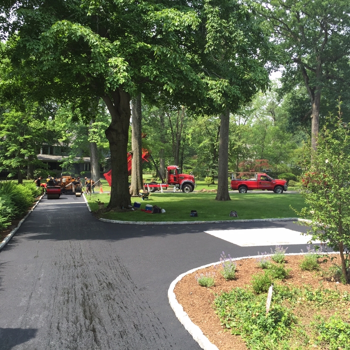 Asphalt driveway with belgian block border