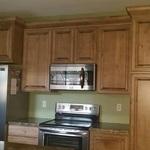 small kitchen with stained wood cabinets