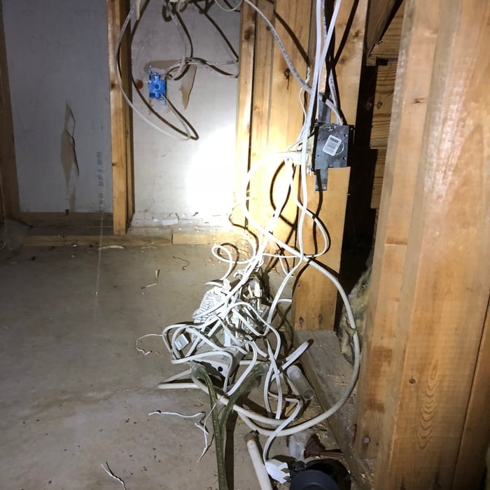 Lamp cord in the crawl space , A FIRE HAZARD