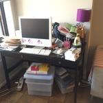 Before picture of messy desk area