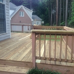backyard deck with railing and steps to backyard