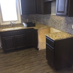 new floors, enameled cabinets and backsplash