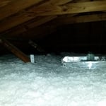 Insulation around attic fan
