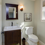 lovely bathroom with dark stained vanity base