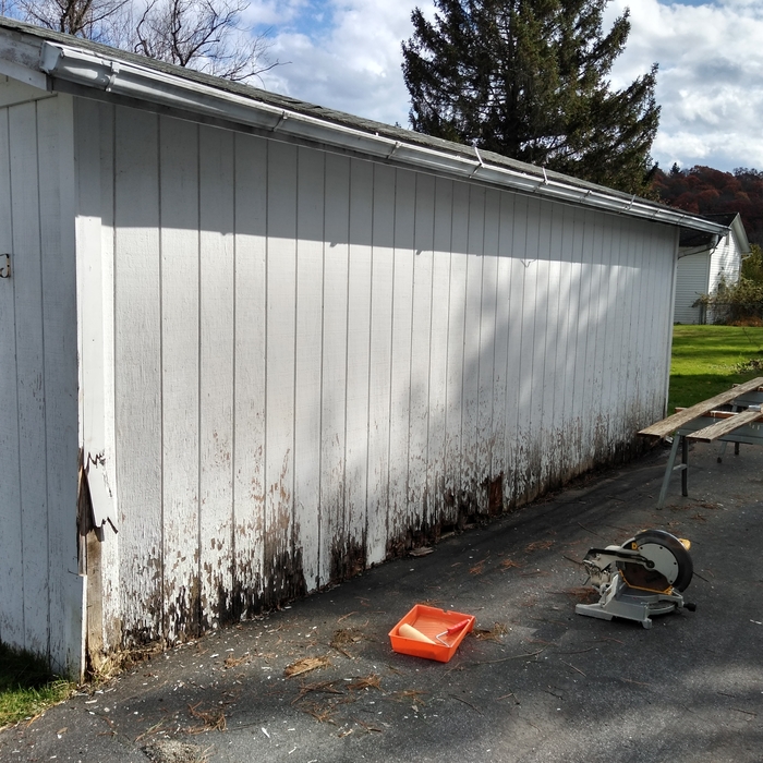 Garage wall repaired, painted