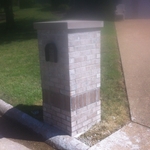 brick mail box with 4 way wash limestone cap