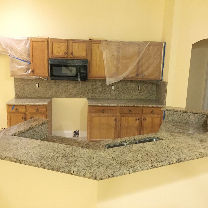 Giallo Ornamental Kitchen with Full High Backsplas