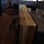 Custom hickory bar with metal corner frame.