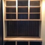 Mudroom with custom alder cabinetry and bench.