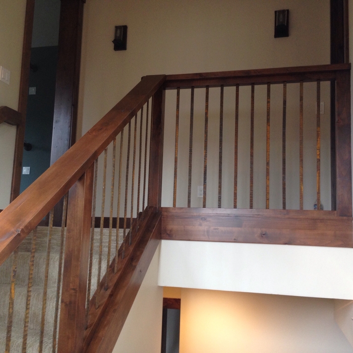 Alder handrail with decorative rustic metal picket