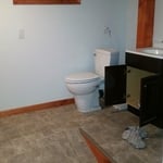Installed shower and up flush toilet